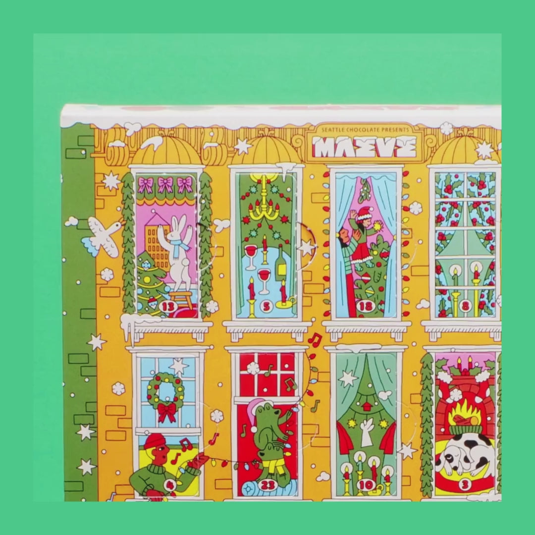 details of Holiday chocolate advent calendar with colorful window scenes on a white background